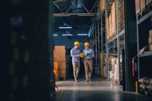 Manufacturing Workers Walking in Warehouse
