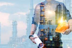 A man fading out in front of an oil well to represent remote work.